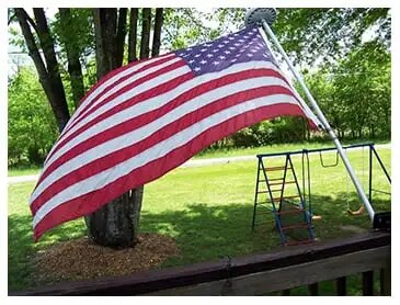 Carol Rhodes U.S. flag flying from her front porch