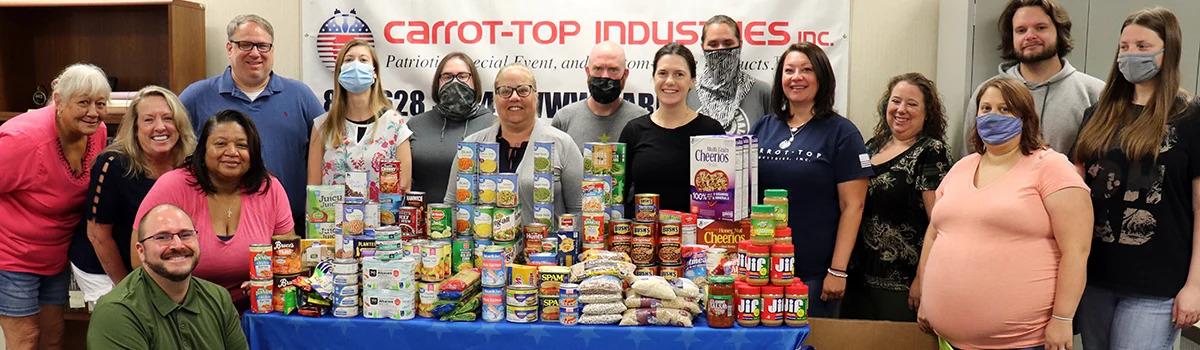 Carrot-Top Industries staff with OCIM food donations