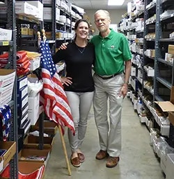 Liz Morris and Dwight Morris in Carrot-Top Industries Warehouse