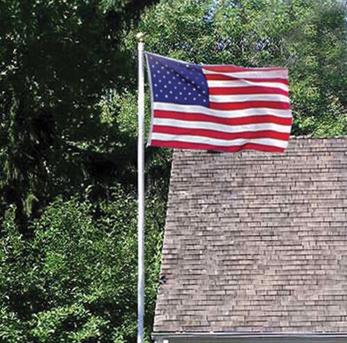 American flag flying near house