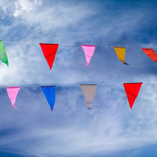 colorful flags against blue sky