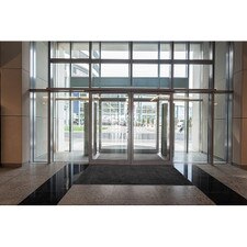 glass entrance with revolving doors