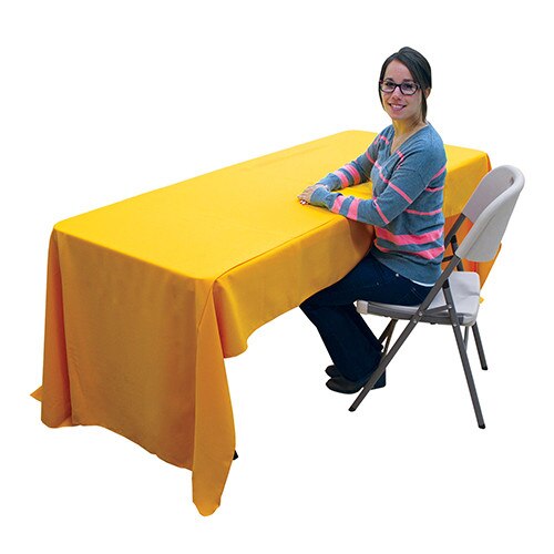 woman sitting at yellow table