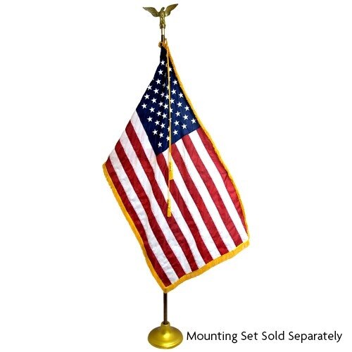 US flag mounted on a gold stand