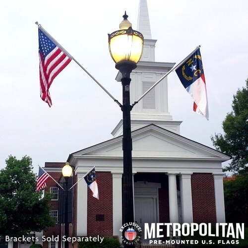 Lamp post with flags and church bac