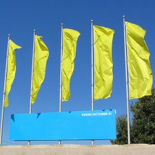 yellow flags with blue sign