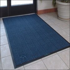 blue woven door mat on tile floor