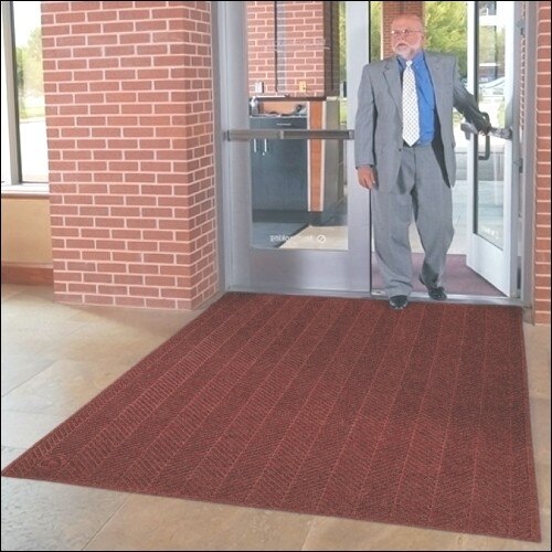 man in suit exiting building entry