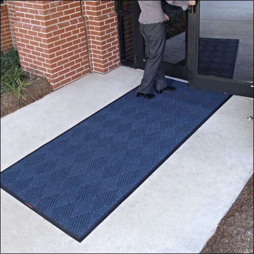 person entering building mat