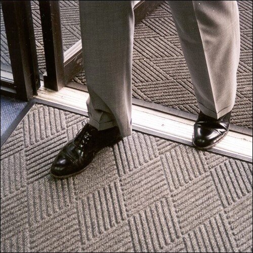 man in suit standing at doorway