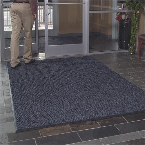 person standing on entrance mat