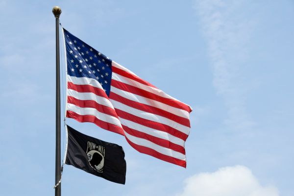 POW/MIA Flag and American Flag on Flagpole